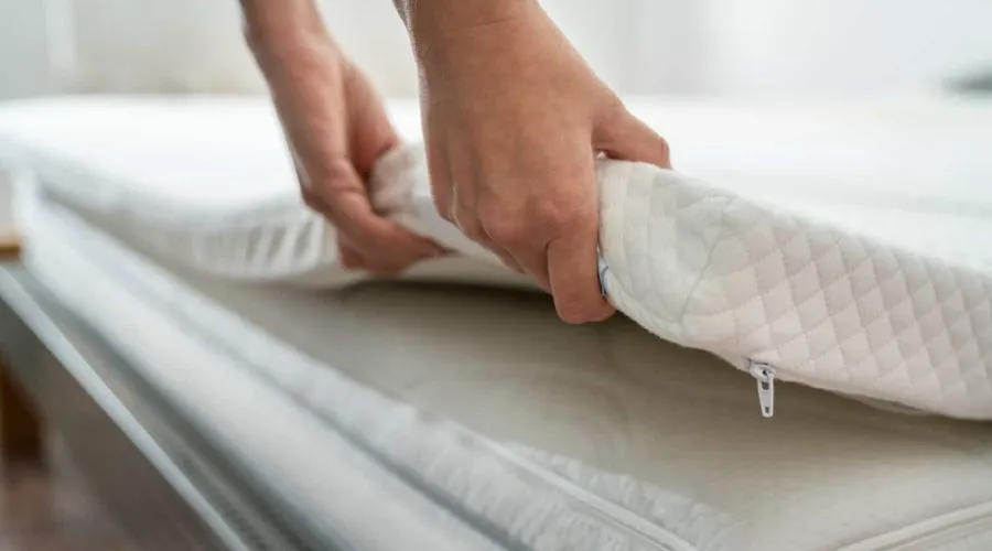 How easy is it to clean and maintain a reversible mattress topper